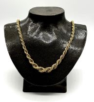 A 9ct two tone gold graduated rope chain with white gold box chain intertwined - total weight 22.2g