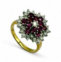 An 18ct gold cluster ring set with diamonds and rubies - size O, total weight 7.12g