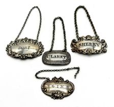 A collection of four hallmarked silver decanter labels including Claret, Sherry, Port and Gin -