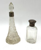 Two antique silver topped scent and vanity bottles