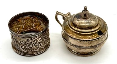 A hallmarked silver mustard pot along with a silver serviette ring - total silver weight 101.91g