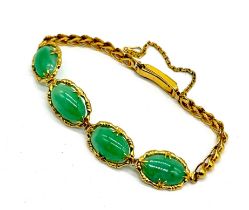 A high carat (21/22ct) gold Chinese bracelet set with apple jade cabochons- total weight 12.02g
