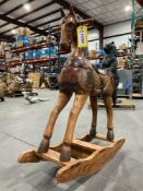 WOODEN CARVED ROCKING HORSE APPROXIMATELY 40 W X 17 W X 50 H