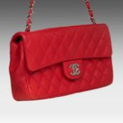 A Chanel coral red classic flap bag 13 x 25 x 4.5 cm. (5.12 x 9.83 x 1.77 in.)