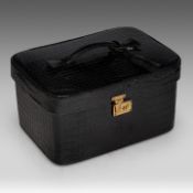 A Delvaux vanity case in croco leather, with palladium hardware, ca 1980, H 17 - W 31 - D 23 cm