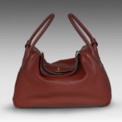A Hermes Lindy 34 Rouge Hermes veau swift leather handbag with CC hardware 22 x 34 x 16 cm. (8.66 x