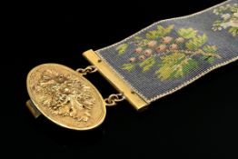 Empire Armband mit vergoldeter Rosettenschließe "Weinlaub und -trauben" an fein gewirktem Textilban
