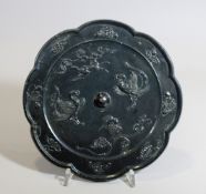 Bronzespiegel, Tang Dynastie, China, Vogel und Pferdemotive, achtblättrige Form, Maße: Durchmesser 
