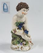 Putto (Cherub) mit Trauben.