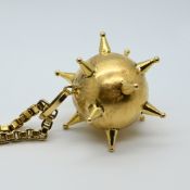 1 Kette GG 18ct. wohl mit Morgenstern-Anhänger undeutl. gest./wohl GG 18ct.