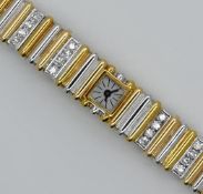 1 Damenarmbanduhr GG/WG 18ct. 