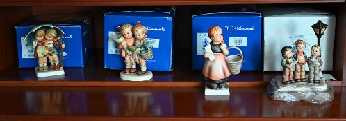 4 Hummelfiguren, versch. Motive mit Original-Karton
