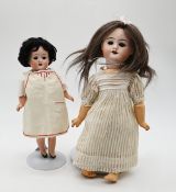 2 kleine Porzellankopfpuppen:
