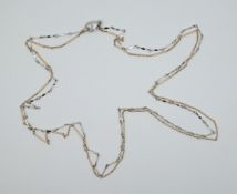 1 Kette am Verschluss gest. 750, wohl Gold m. Silber, 