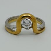 1 Damenring GG/WG 18ct. mit Solitärbrillant lt. Schiene 0,55ct., Ringgröße ca. 53,5, Asp./Tsp.