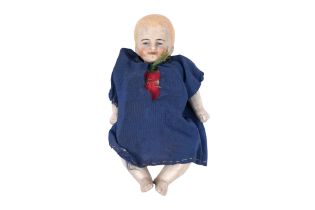 AN EARLY 20TH CENTURY GERMAN FULLY BISQUE PORCELAIN MINIATURE DOLL