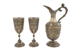 A VICTORIAN SILVER-GILT ‘CELLINI’ PATTERN EWER AND PAIR OF GOBLETS Stephen Smith, London 1874 and 18