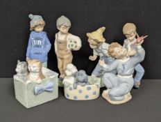 A Nao, by lladro, Boy with Toy Plane; others, Kittens, Puppies, Boy with Football; Boy with Dog; Boy