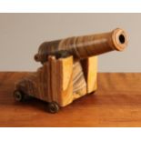 An unusual 19th century agate and bronze mounted desk model, of a cannon, 14.5cm high, 17.5cm long