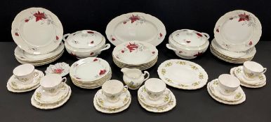 Ceramics - a Polish Cmielow rose decorated dinner service, comprising tureens, platter, five shallow