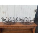 Pair of ornate metal wall planters