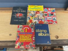 Stamp albums, vintage photographs and postcards