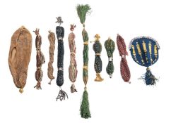 A collection of nine various embroidered fabric, netting and beadwork misers' purses,