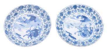 A pair of Chinese blue and white moulded saucer dishes,