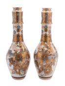 A pair of large Japanese Satsuma vases, Meiji period of slender bottle form,