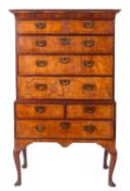 A George II walnut and banded chest on stand,