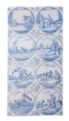 A panel of eight 18th century Dutch Delft tiles each painted in blue with a circular panel