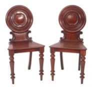 A pair of Regency mahogany hall chairs,