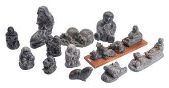 A collection of twelve Inuit simulated argillite composition figural models,