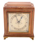 Elliot, London a late-twentieth century walnut mantel clock having an eight-day duration,