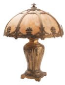 A gilt metal and marbled ochre glass table lamp,