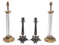 A pair of brass mounted moulded glass columnar table lamps,