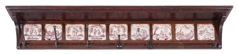 A Dutch oak and Delft tile inset hall rack,
