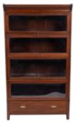A stained hardwood and glazed stacking bookcase, almost certainly by Globe Wernicke,