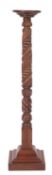 A Victorian carved walnut pedestal or torchere stand,