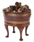 A George II brass banded mahogany cellaret, mid 18th century; of oval section,