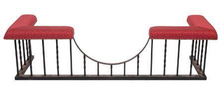 A substantial wrought iron and upholstered club fender,
