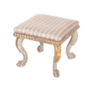 A Venetian carved, painted and parcel giltwood dressing table stool, in 18th century taste,