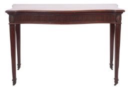 A George III mahogany serpentine front serving table,