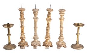 Two similar pairs of Italian carved and silvered wood pricket altarsticks,