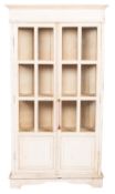 A Continental white painted wood and glazed display cabinet,