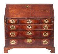 A George III mahogany bureau, last quarter 18th century; the fall front in two parts,