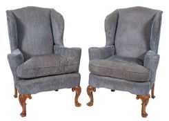 A pair of upholstered wing armchairs in early 18th century style,