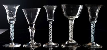 Five Dutch wine glasses comprising a close pair with bell shaped bowls engraved with a wreath and