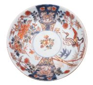 A Japanese Imari saucer dish, Edo period painted with fan-shaped panels of cranes,