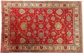A Tabriz carpet, the rose field with an all over palmette and scrolling floral foliate design,